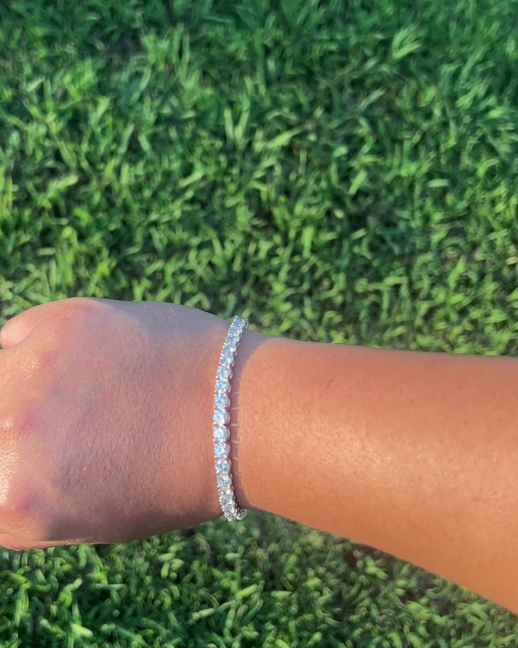 Close-up of 5mm moissanite tennis bracelet on wrist